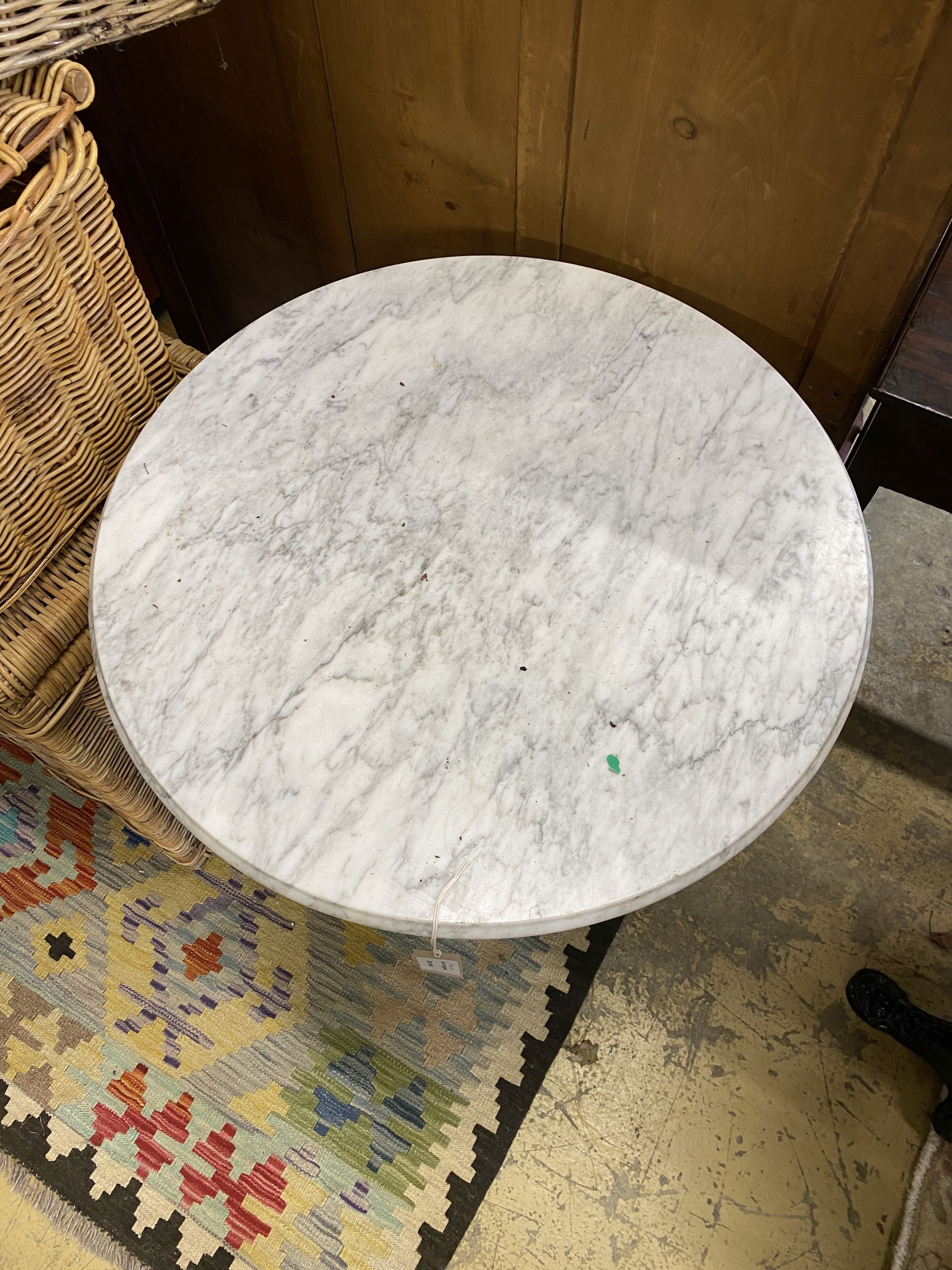 A pair of Victorian style cast iron circular marble topped pub tables, diameter 64cm, height 72cm